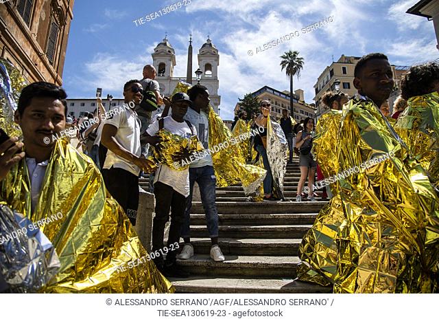 Members of 42 NGOs during the flash mob for the lauch of campaign #Ioaccolgo (I welcome) on the steps of Piazza di Spagna in Rome, ITALY-13-06-2019