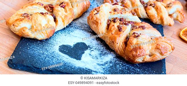 marple and pecan plait pastry sweet food breakfast with heart sign, tea time banner background
