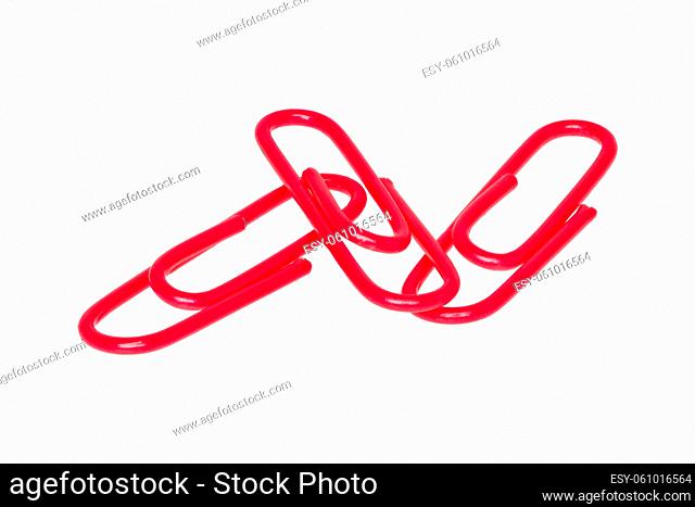 Red paper clips isolated on a white background
