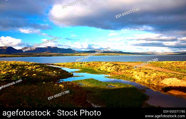 Beautiful lake Svinavatn in the northwest of Iceland with mountains in the background. The evening sun lightens up the scene
