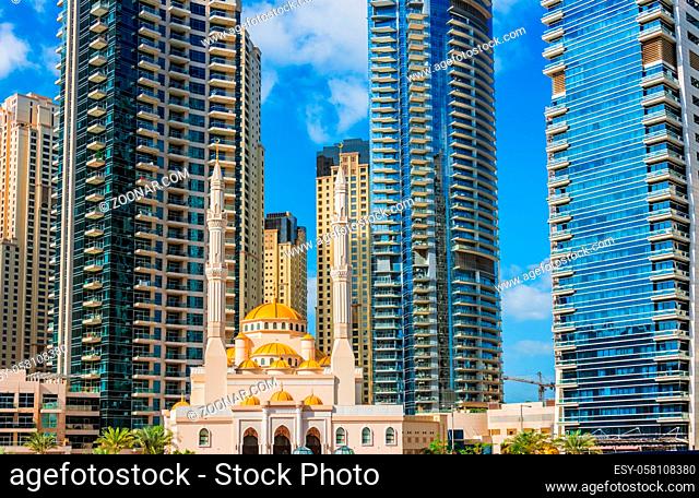 Modern residential architecture of Dubai Marina and Mohammed Bin Ahmed Almulla Mosque, United Arab Emirates