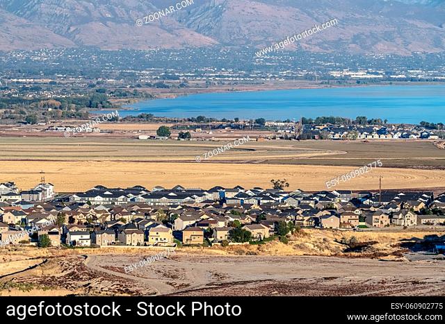 Aerial view of Utah Lake and housing estate in the Utah Valley from an elevated viewpoint on a mountain
