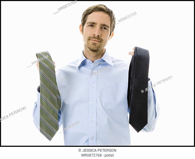 man choosing a tie