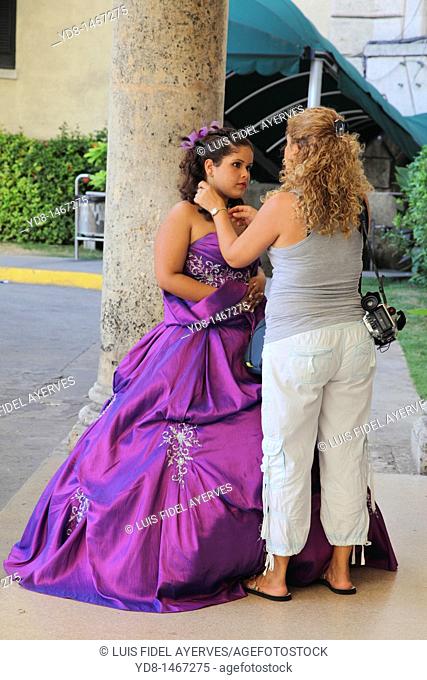 Cuban Quinceanera preparing for a video photo section at the entrance of the Hotel Nacional in Vedado, Havana, Cuba