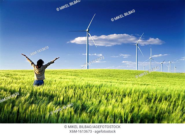 woman in a windmills field, windfarm