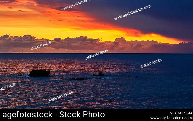 Greece, Greek Islands, Ionian Islands, Corfu, west coast, Prasoudi, sunset, rocks in the sea, sky gray-blue to red
