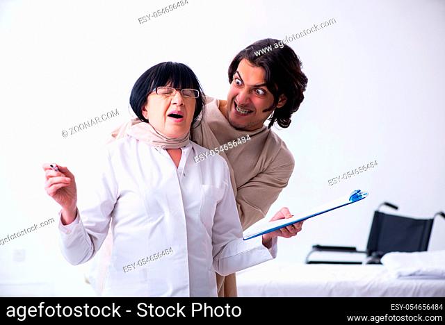 The old female psychiatrist visiting young male patient