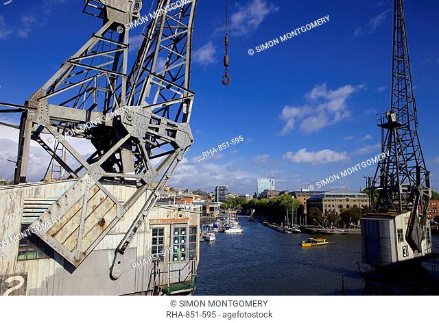Bristol's floating harbour and an old Dockside crane, Bristol, England, United Kingdom, Europe
