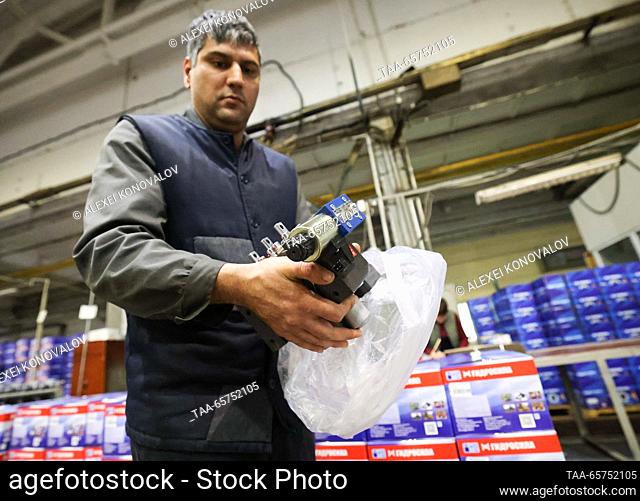 RUSSIA, ZAPOROZHYE REGION - DECEMBER 14, 2023: An employee is at work at the MDK-Gidrosila plant, a producer of hydraulic cylinders for tractors and...