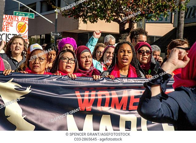 Multiracial women lead the January, 2017 Anti-Trump Women's March in Santa Ana, CA