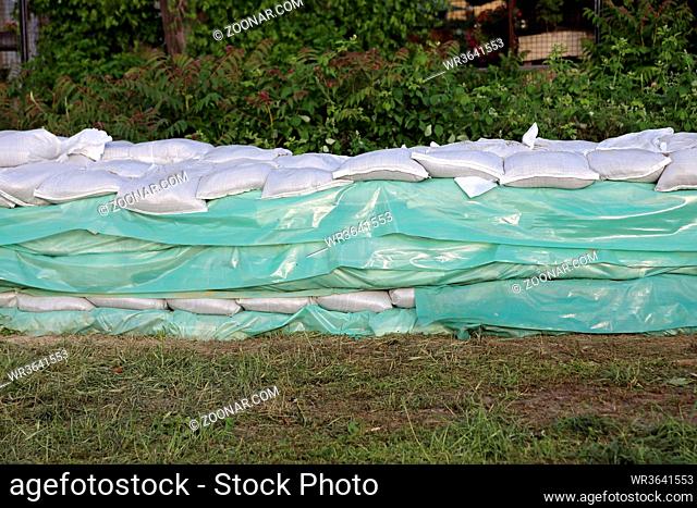Wall of Sand Bags and Tarp for Floods Protection