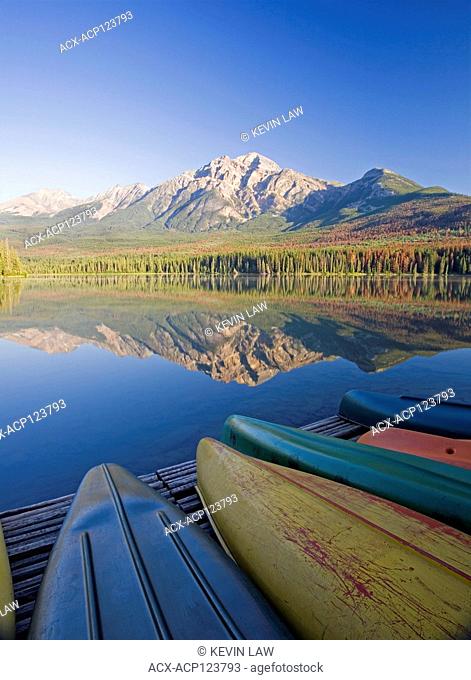 Canoes on dock at Pyramid Lake and Pyramid Mountain, Jasper National Park, Alberta, Canada