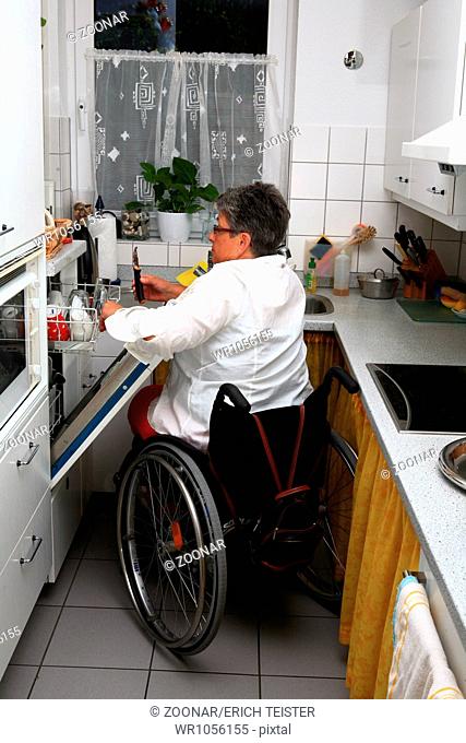woman in a wheel chair in the kitchen