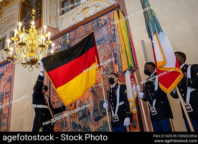 25 October 2021, Bavaria, Munich: US soldiers sort the flags before the start of the Bavarian Prime Minister's flag ribbon award ceremony for US Army Europe...