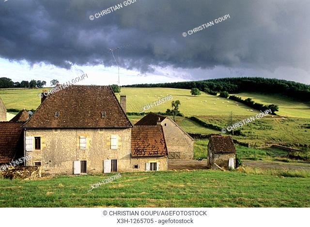 farmhouse under stormy sky, around Nevers, Nievre department, region of Burgundy, center of France, Europe