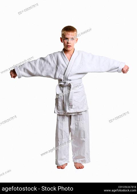 Full-length portrait of a boy in a sporting kimono with spread arms