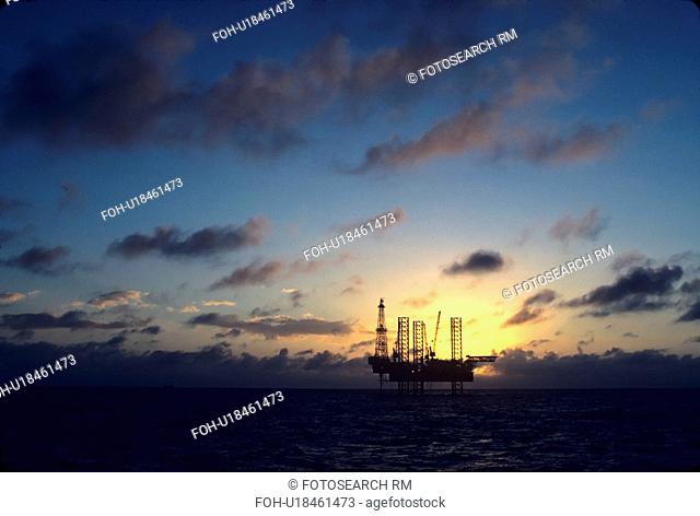 Offshore Oil Drilling Rig at Sunset
