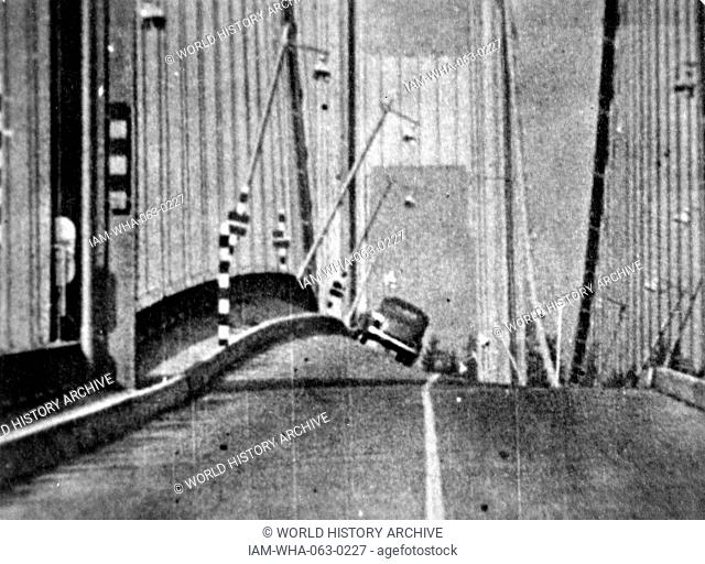 Photographic print of the original Tacoma Narrows Bridge before it's wind induced collapse. The print depicts the physical phenomenon known as aerolastic...