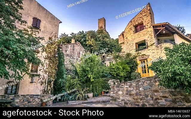 Village street in Roquebrun. The commune is located in the Regional Natural Park of Haut-Languedoc. Donjon of a castle from the Carolingian period