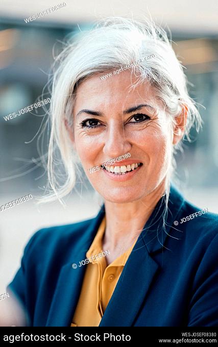 Smiling business person with gray hair