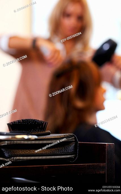 Hairdresser salon. Woman during haircut