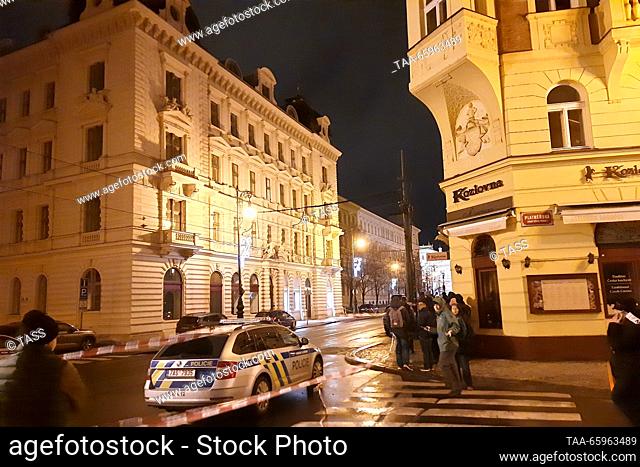 CZECH REPUBLIC, PRAGUE - DECEMBER 21, 2023: Police tape off the scene of a mass shooting outside the Faculty of Philosophy, Charles University