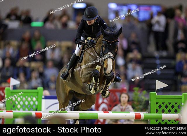19 February 2023, Schleswig-Holstein, Neumünster: Equestrian sport/jumping: Grand Prix (Riders Tour Final). Johanna Beckmann (Brunsbüttel) rides Emelie van de...