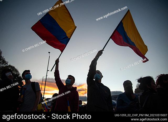 Demonstrators wave Colombian national flags as Demonstrators gathered at El Campin Futball stadium to protest against the Copa America tournament
