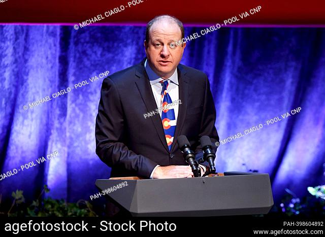 Governor Jared Polis (Democrat of Colorado), talks before United States Vice President Kamala Harris speaks at the Arvada Center for Performing Arts in Arvada