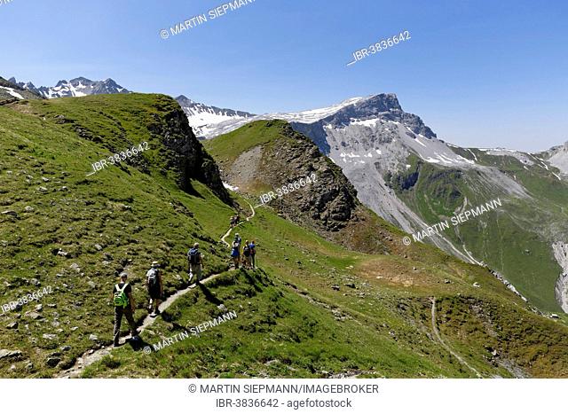 Hikers on a smugglers' trail, Mt Rätschenfluh, Madrisa, Rätikon mountain range, Graubünden or Grisons, Switzerland