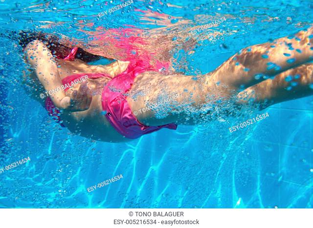 underwater pink bikini little girl swimming in pool