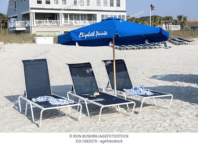 Beach umbrellas line the waterfront at Elizabeth Pointe Lodge resort hotel at Amelia Island, Florida