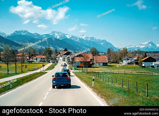 Car driving on the highway with mountains in the background