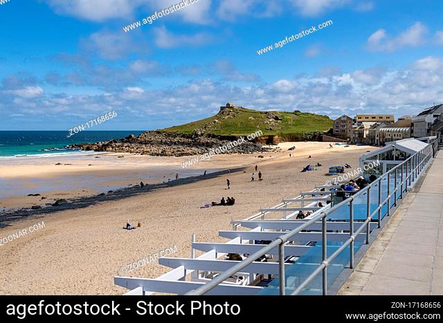 ST IVES, CORNWALL, UK - MAY 13 : View of Porthmeor beach at St Ives, Cornwall on May 13, 2021. Unidentified people