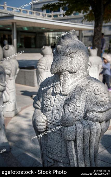 Chinese Zodiac, stone Rooster statue next to the National Folk Museum of Korea in Seoul, South Korea