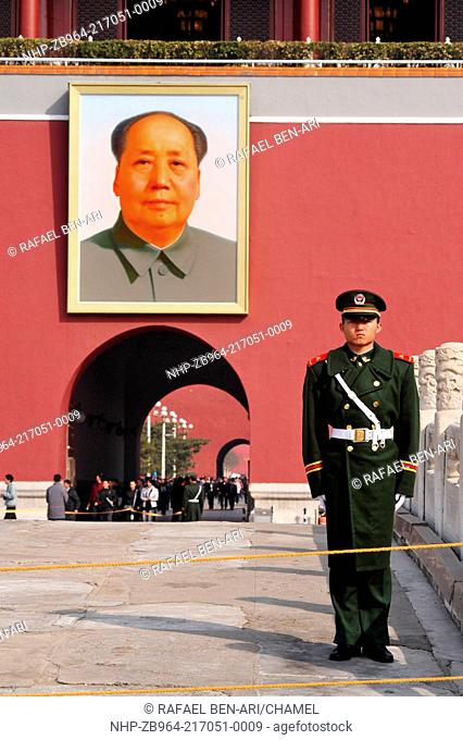 BEIJING - MARCH 11:Chinese soldier stands guard in front of a portrait of Mao Zedong in Tiananmen square on March 11 2009 in Beijing