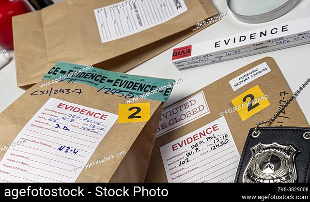 Files and evidence bag in a crime lab, conceptual image