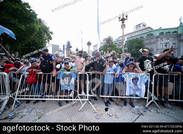 26 November 2020, Argentina, Buenos Aires: Fans queue up for Diego Maradona's wake at Casa Rosada. Maradona had died of a heart attack on Wednesday (25