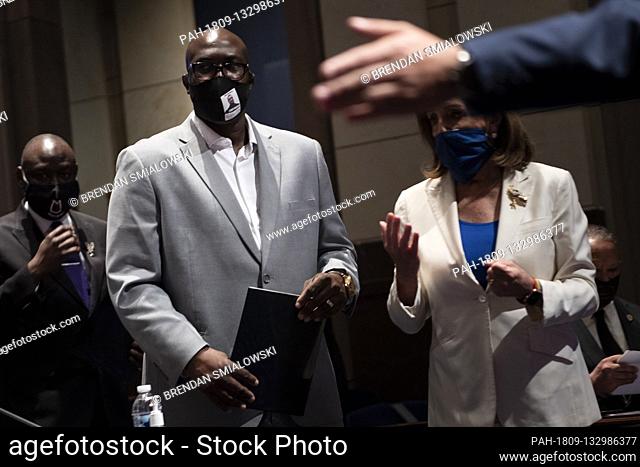 Speaker of the House Nancy Pelosi (D-CA) walks with Philonise Floyd, Brother of George Floyd, as he arrives for a hearing on Capitol Hill of the House Judiciary...