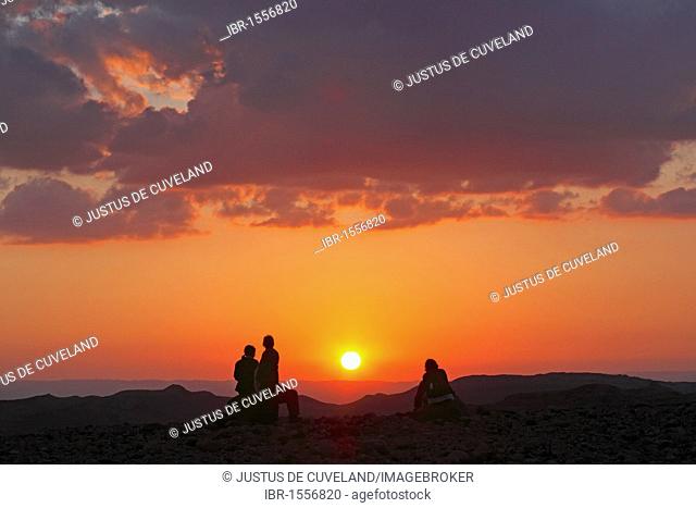 People watching the sunset over the desert, landscape in the Dana Biosphere Reserve near Feynan, Hashemite Kingdom of Jordan, Middle East