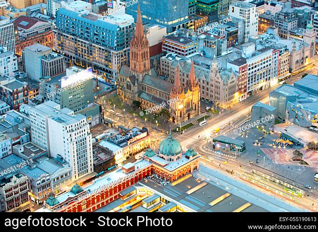 Swanston St and Flinders St intersection just before sunrise in Melbourne CBD in Victoria, Australia