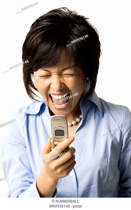Woman with cell phone shouting