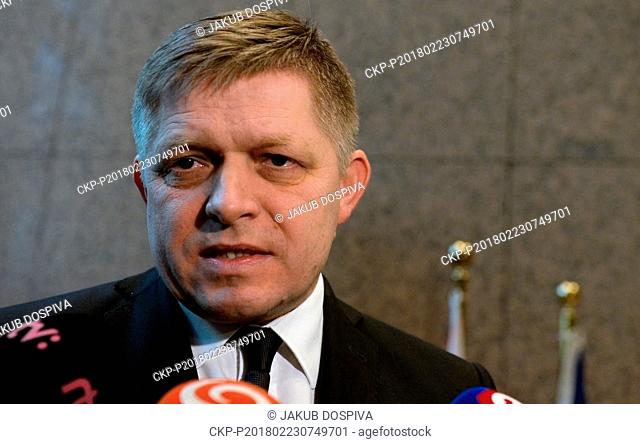 Slovakian Prime Minister Robert Fico speaks with journalist prior to an EU summit at the Europa building in Brussels on Friday, Feb. 23, 2018