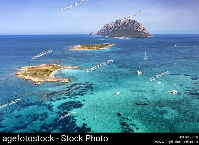 Aerial view of Tavolara Island surrounded by a clear and turquoise sea in Sardinia, Italy