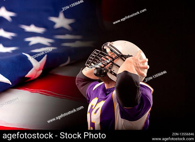 Shocked American Football Player looking up to the score with US flag on background