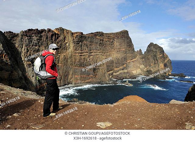 young woman walking on Cevada islet, Sao Lourenco peninsula, Madeira island, Atlantic Ocean, Portugal