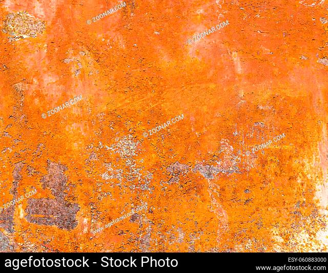 Rusted metal plate with peeling paint. Severe metal corrosion. Grungy texture. Background series