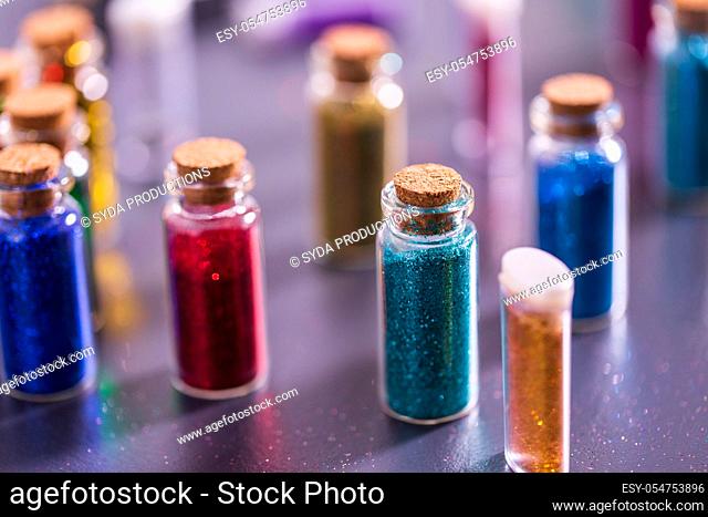 set of different color glitters in bottles