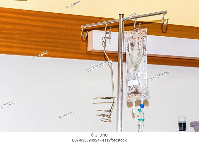 IV bag in a hospital filled with liquid attached to an infusion stand