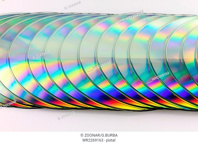 Close up of CDs on white background